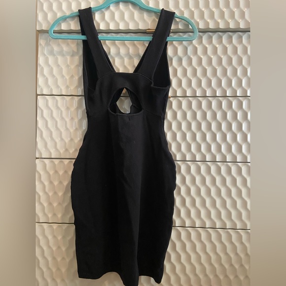 FREE PEOPLE BEACH Black Sleeveless Twist Front Cutout Knit
Bodycon Mini - Picture 2 of 3